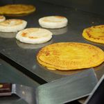 Arepas on the griddle<br>